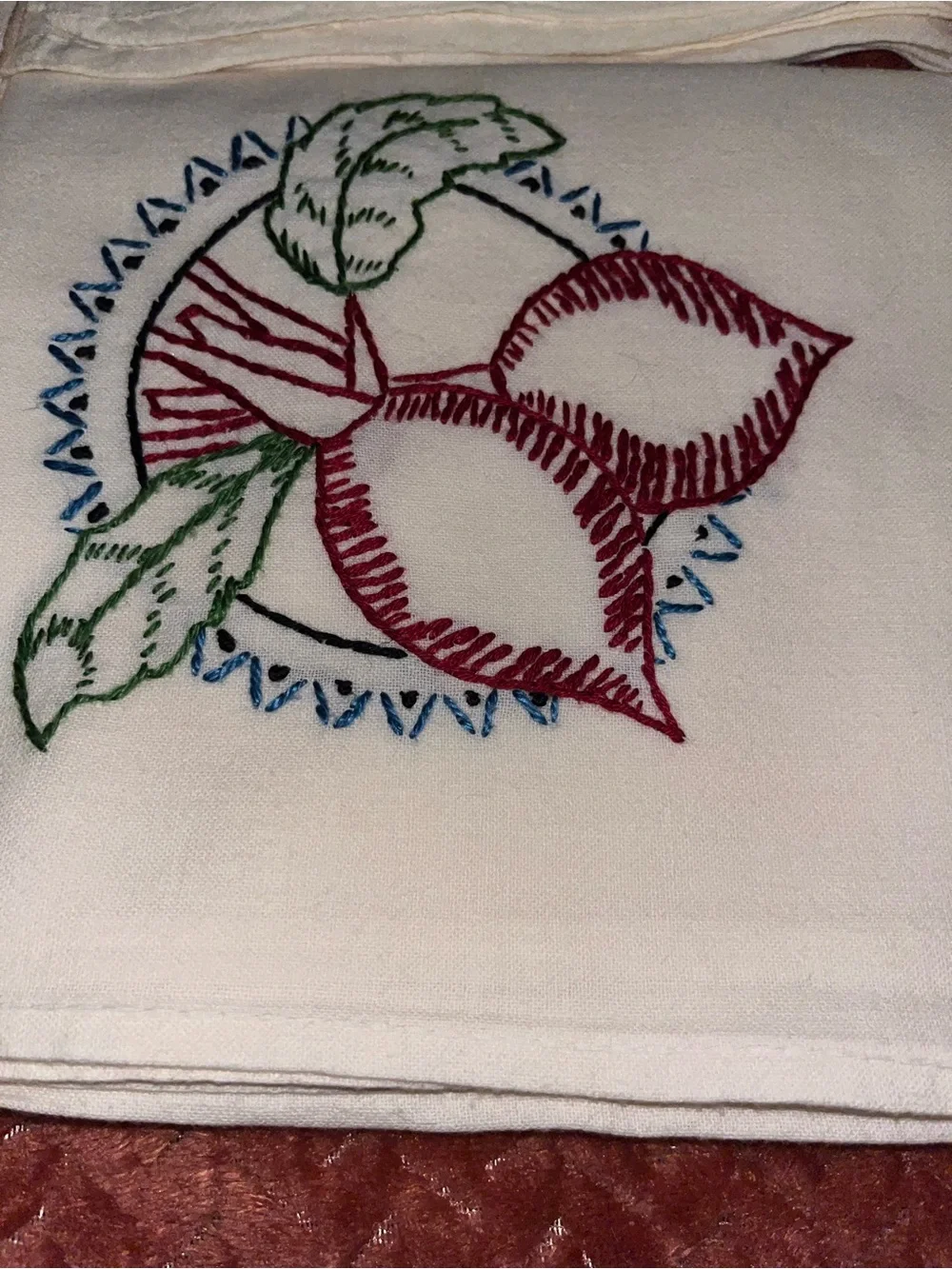 Vegetable embroidered table linens.